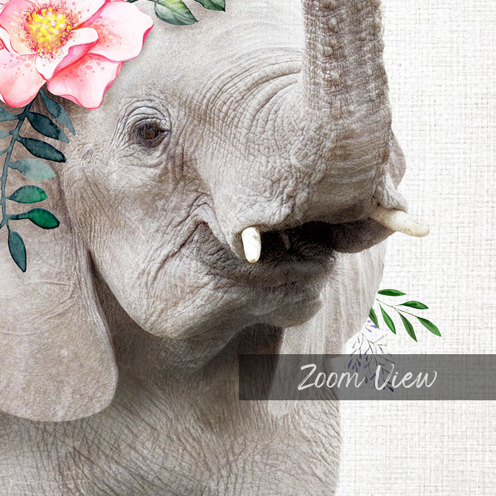 A close-up of an elephant's face, with a pink flower adorning its ear and green leaves surrounding its trunk.