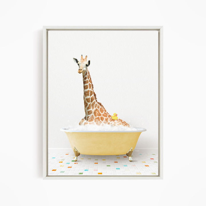 A giraffe is sitting in a yellow bathtub filled with bubbles, with a yellow rubber duck floating on the water.