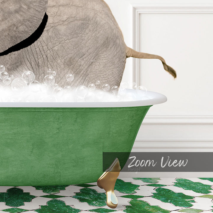 A green bathtub filled with bubbles, with a gold faucet and a gold-colored elephant figurine sitting in the tub.