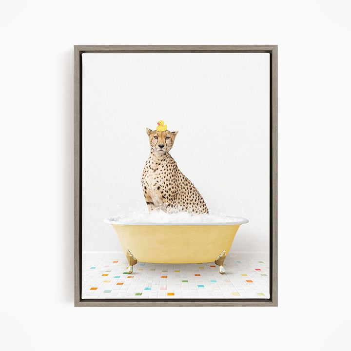 A cheetah sitting in a yellow bathtub filled with water, with a rubber duck on its head.