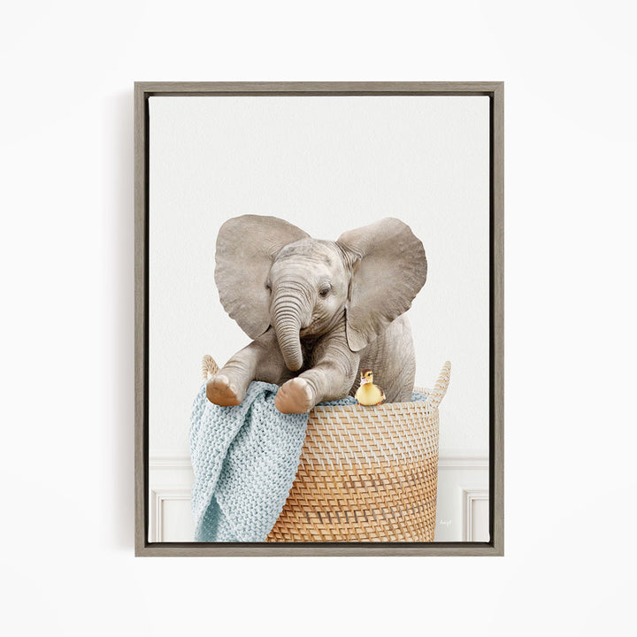 Baby Elephant in Laundry Basket - Simple White Wall