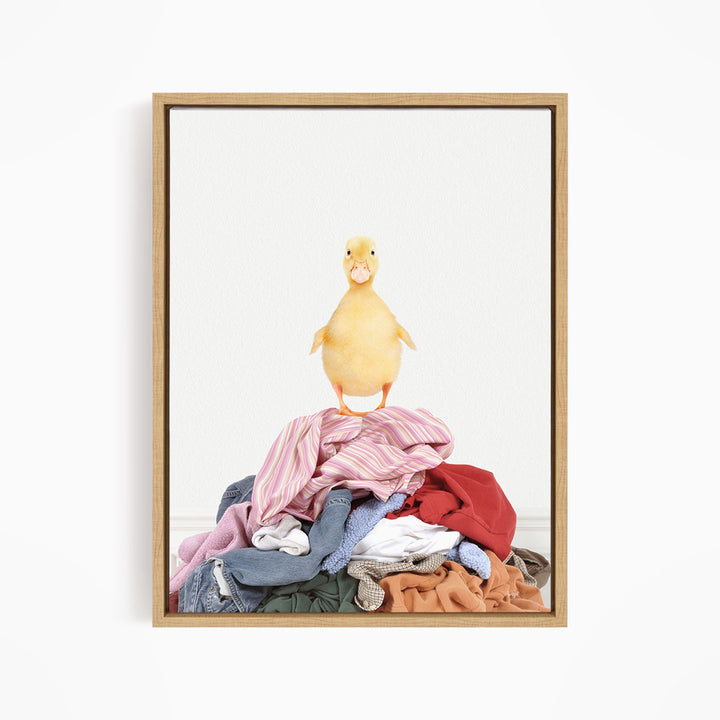 Yellow Ducky on Clothes Pile - Simple White Wall