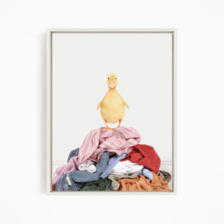 Yellow Ducky on Clothes Pile - Simple White Wall