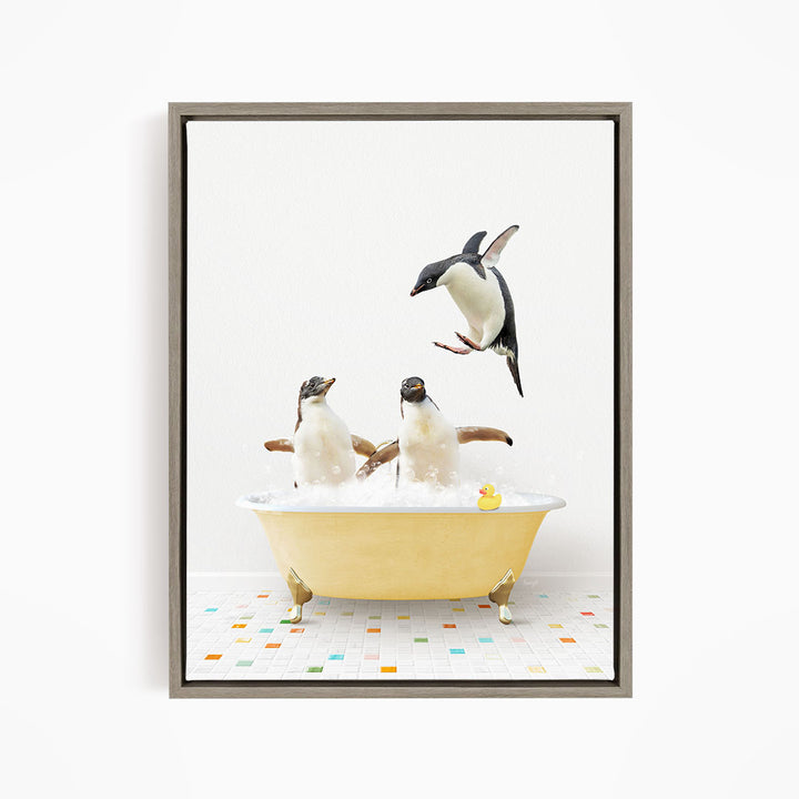A framed image depicting two penguins sitting in a yellow bathtub, with one penguin flying towards the other.