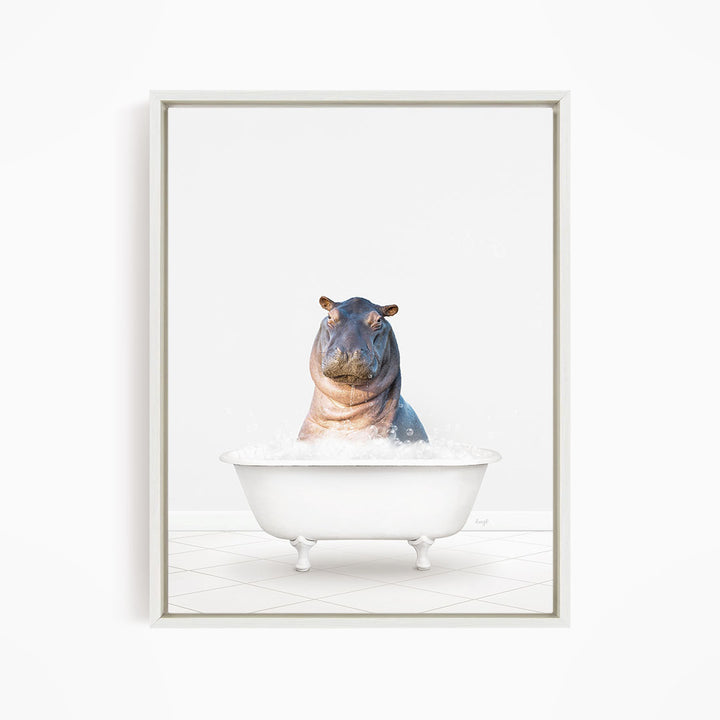A hippopotamus sitting in a white bathtub filled with water.