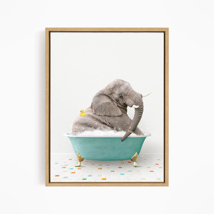 A gray elephant is sitting in a blue bathtub, surrounded by a yellow duck and a colorful tiled floor.