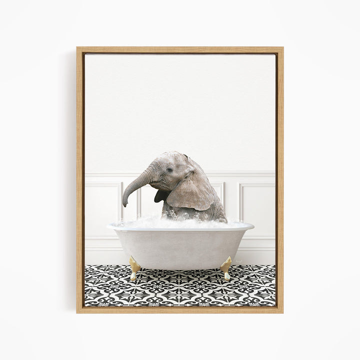 A baby elephant sitting in a white bathtub filled with water, surrounded by a black and white patterned floor.