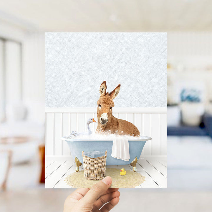 A donkey is sitting in a bathtub filled with bubbles, surrounded by rubber ducks and a towel, in a cozy, homely setting.