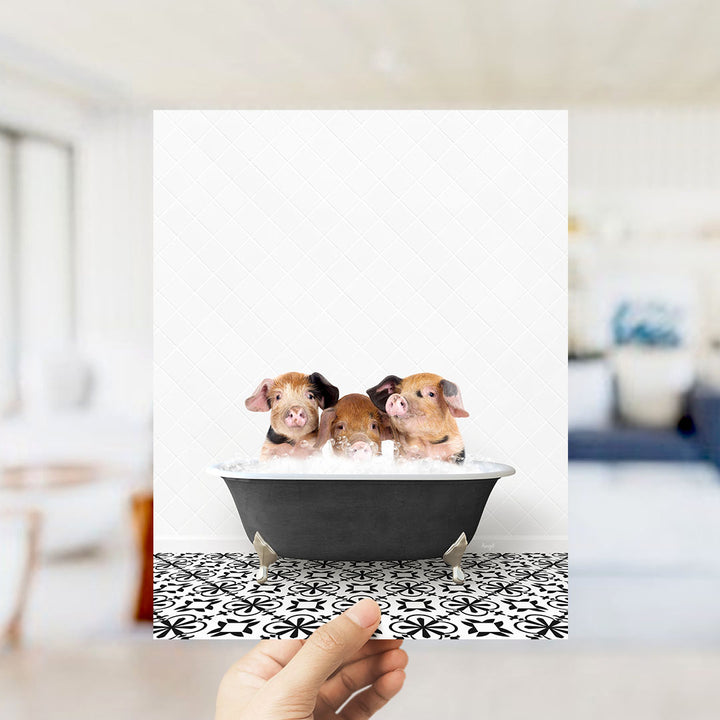 Three adorable pigs sitting in a bathtub, enjoying a relaxing bath.