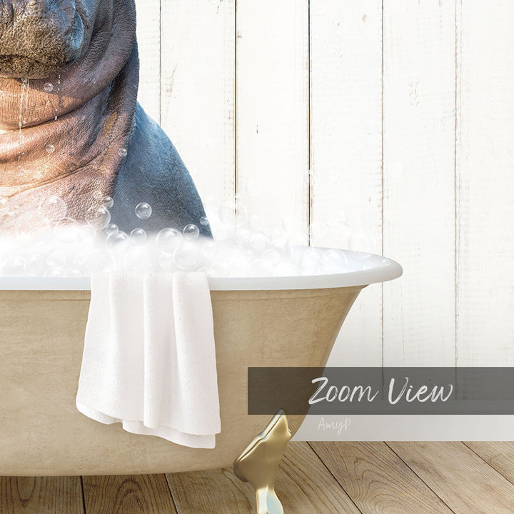 A close-up of a bathtub filled with bubbles, with a towel hanging on the side and a wooden wall in the background.