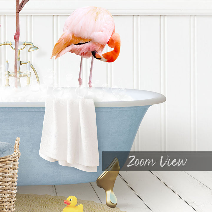 A pink flamingo standing in a blue bathtub filled with water, surrounded by a yellow rubber duck and a white towel.