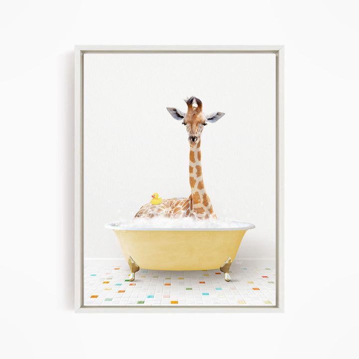 A giraffe is sitting in a yellow bathtub filled with bubbles, with a rubber duck floating nearby.