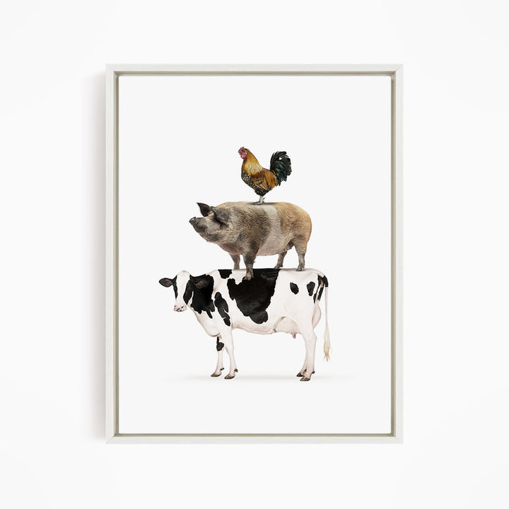A framed illustration depicting a pig, cow, and rooster standing on top of each other.