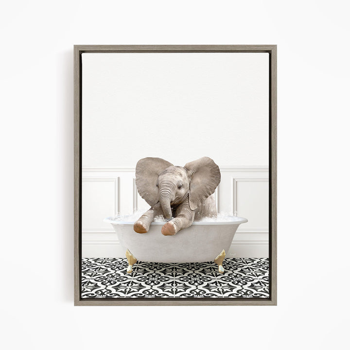 A baby elephant sitting in a white bathtub filled with water, surrounded by a black and white patterned floor.