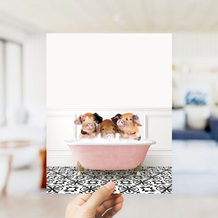 Three adorable pigs sitting in a pink bathtub filled with water, creating a playful and whimsical scene.