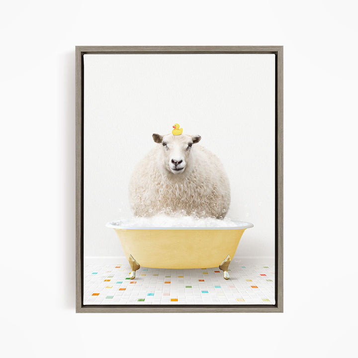 A fluffy white sheep sits in a yellow bathtub filled with bubbles, with a yellow rubber duck perched on its head.