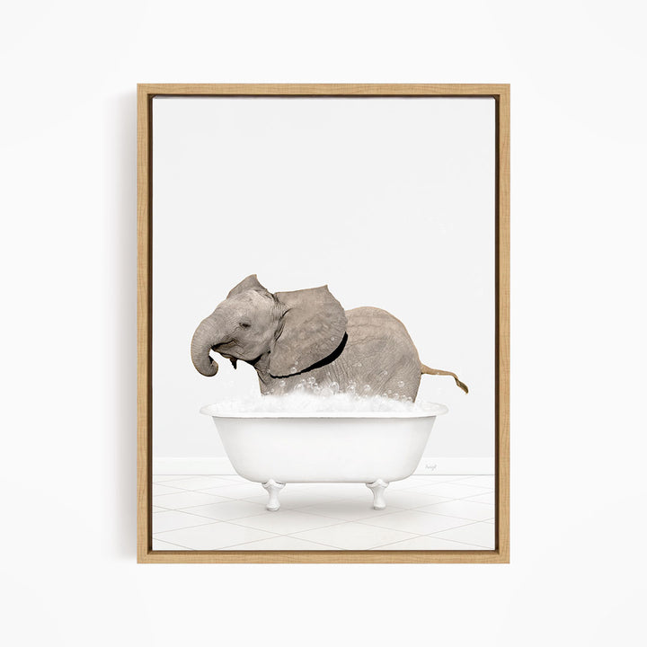 A gray elephant is sitting in a white bathtub filled with bubbles, creating a whimsical and playful scene.