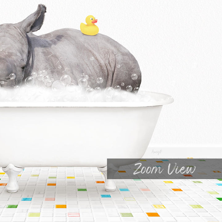A rhinoceros is sitting in a white bathtub filled with bubbles, with a yellow rubber duck perched on its back.