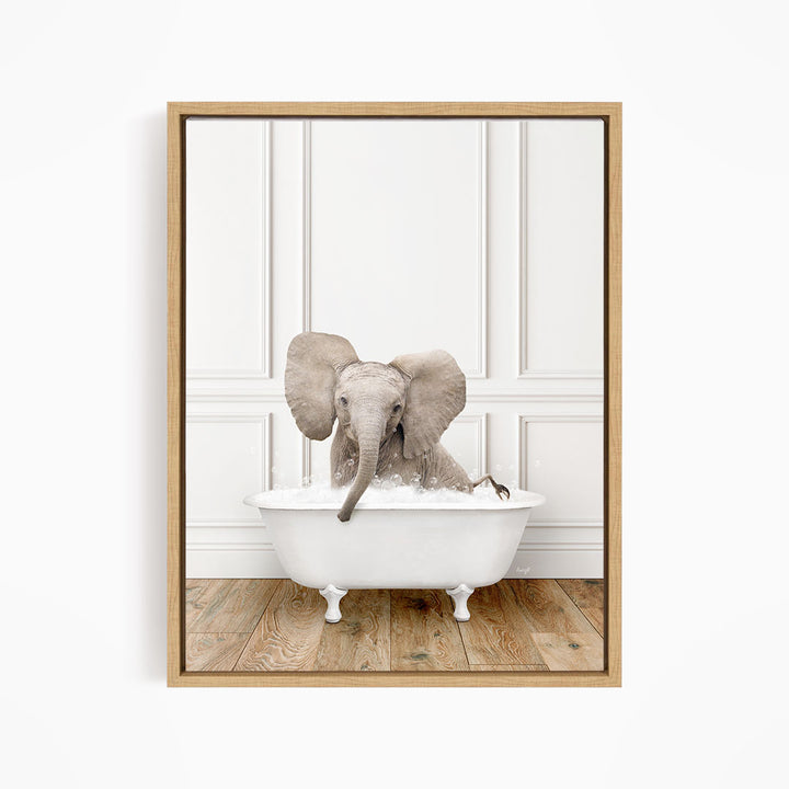 A baby elephant sitting in a white bathtub, with its trunk submerged in the water.