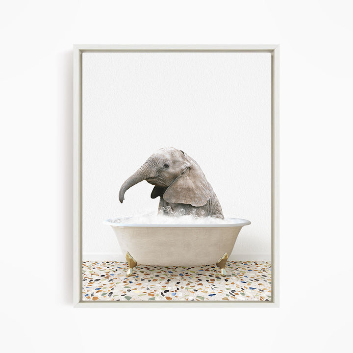 A baby elephant sitting in a bathtub filled with water, surrounded by a tiled floor.