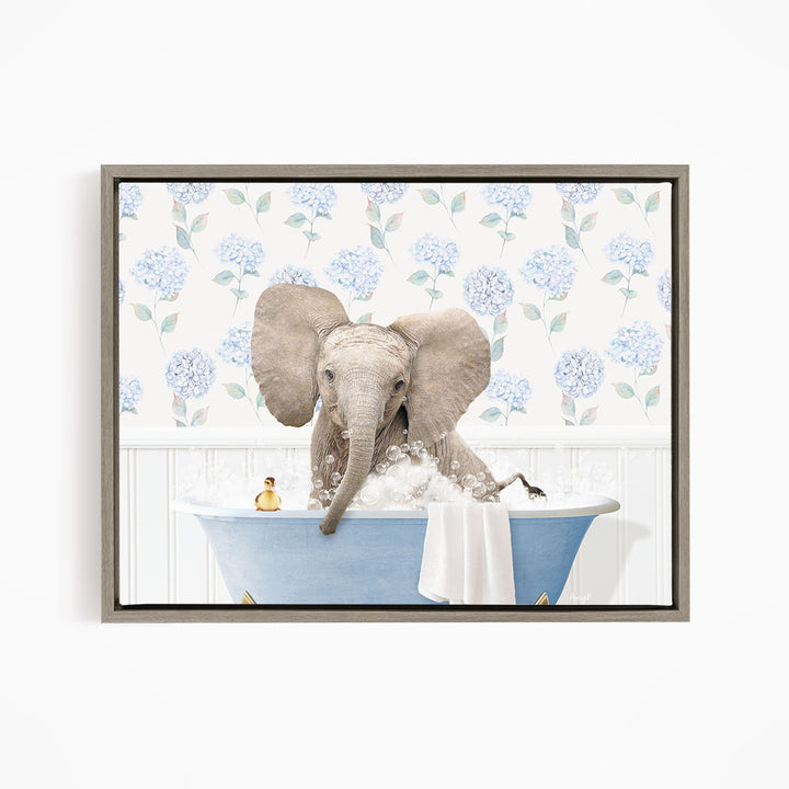 A gray elephant is sitting in a blue bathtub filled with water, surrounded by blue hydrangea flowers on the wall behind it.