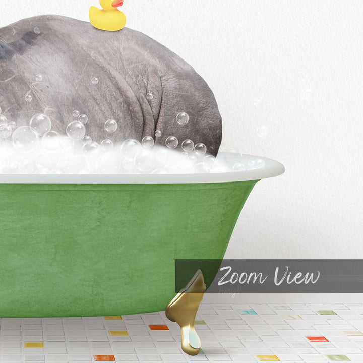 A large gray elephant is sitting in a green bathtub filled with bubbles, with a yellow rubber duck floating on top.