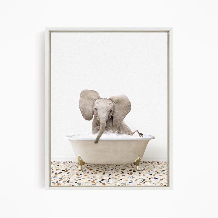 A baby elephant sitting in a bathtub filled with water, surrounded by a tiled floor.
