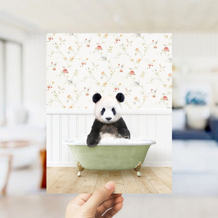 A panda bear sitting in a green bathtub, surrounded by a floral wallpaper.