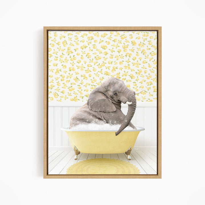 A gray elephant is sitting in a yellow bathtub filled with water, surrounded by a yellow floral pattern on the wall behind it.