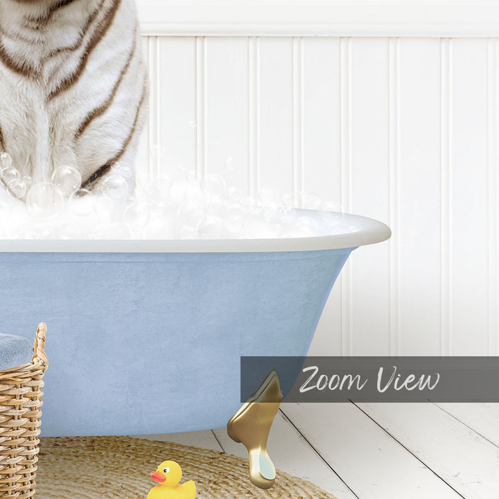 A cat standing in a blue bathtub filled with bubbles, with a rubber duck and a basket nearby.