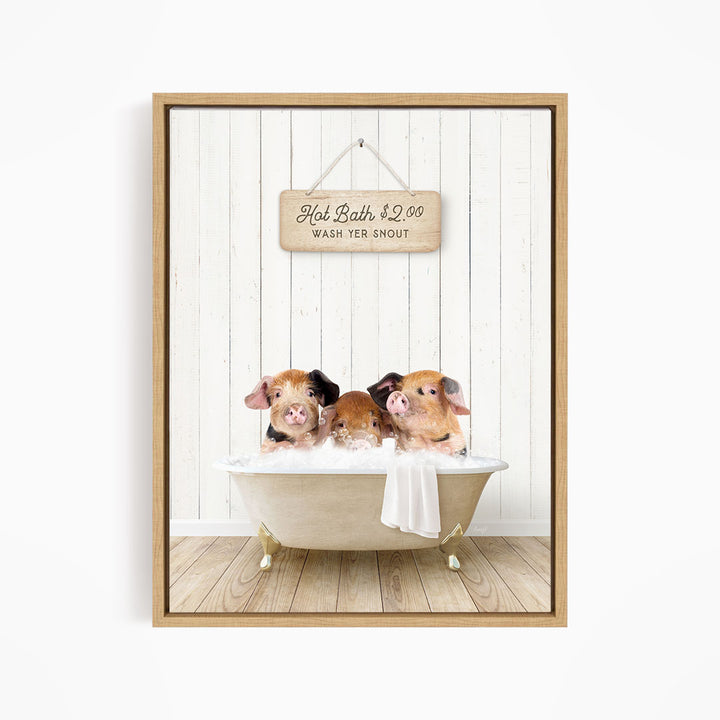 A framed image of three pigs sitting in a bathtub, with a sign above them that reads "Hot Bath $2.00 WASH YER SNOUT".