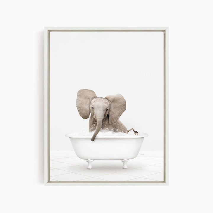 A baby elephant sitting in a white bathtub filled with water, with its trunk submerged in the water.