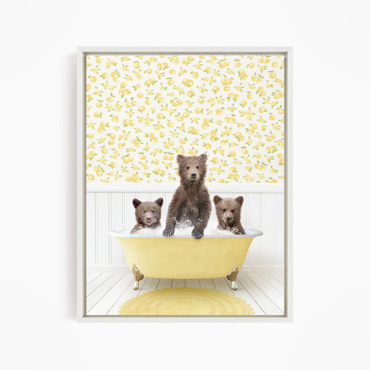 A framed image depicting three bears sitting in a yellow bathtub, with a yellow floral pattern on the wall behind them.