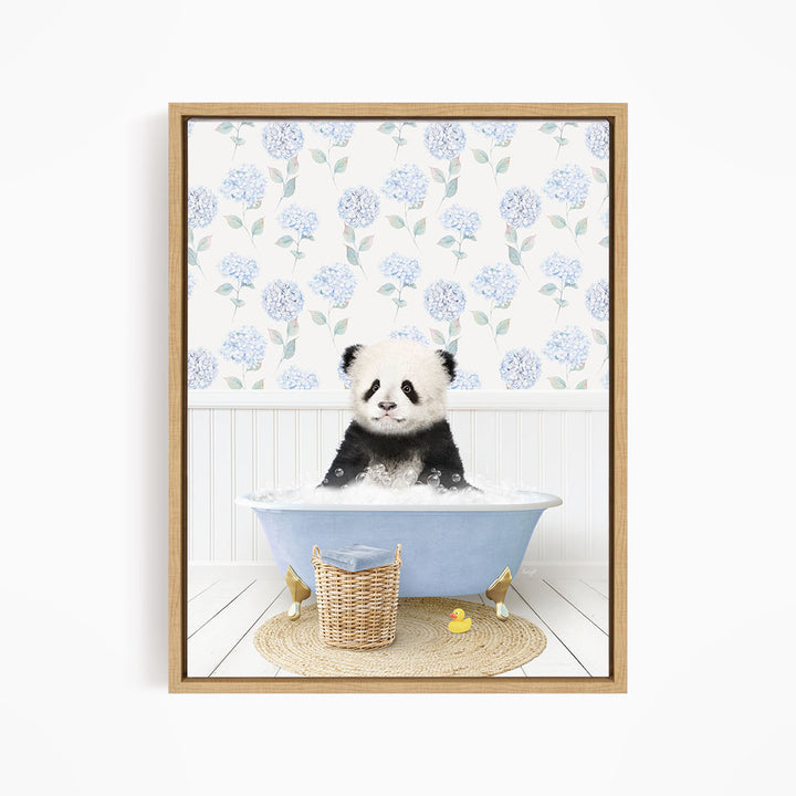A cute panda bear sitting in a blue bathtub, surrounded by a wicker basket and rubber duckies, against a backdrop of blue hydrangea flowers.