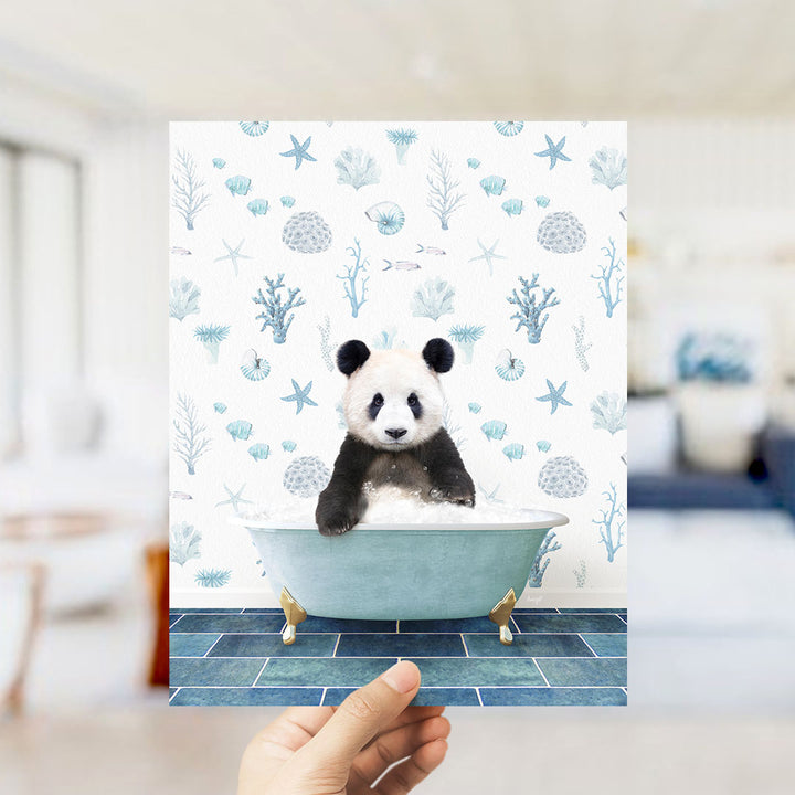 A panda bear sitting in a bathtub filled with bubbles, surrounded by a blue and white ocean-themed wallpaper.