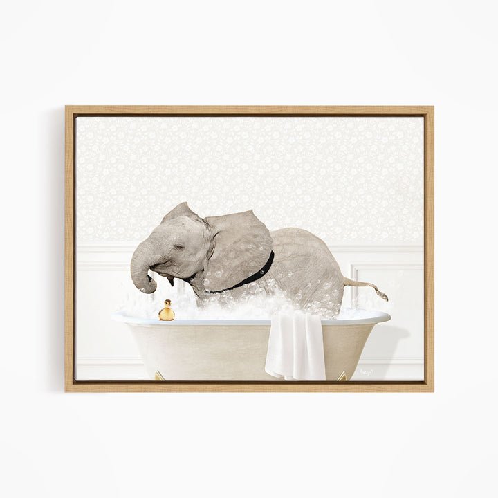 A gray elephant is sitting in a white bathtub, surrounded by bubbles, with a yellow rubber duck floating nearby.