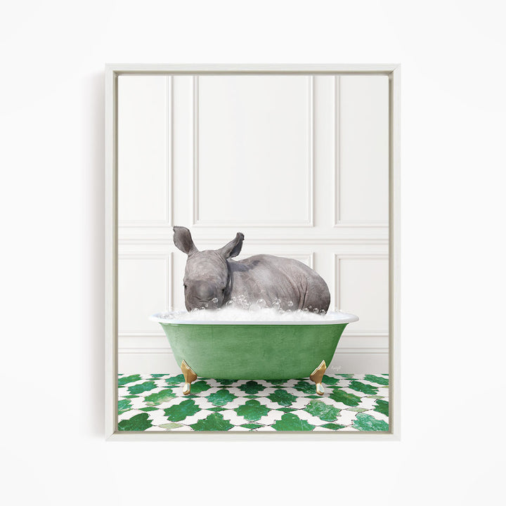 A rhinoceros is sitting in a green bathtub filled with water, surrounded by a green and white patterned floor.
