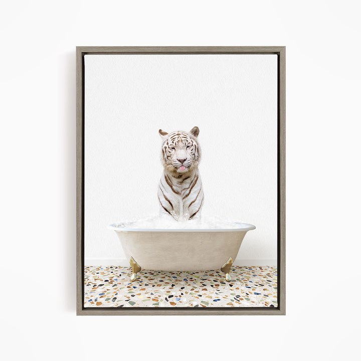 A white tiger sitting in a bathtub filled with water, with its mouth open and tongue sticking out.