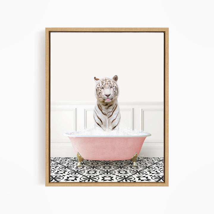 A white tiger sitting in a pink bathtub filled with bubbles, surrounded by a black and white patterned floor.