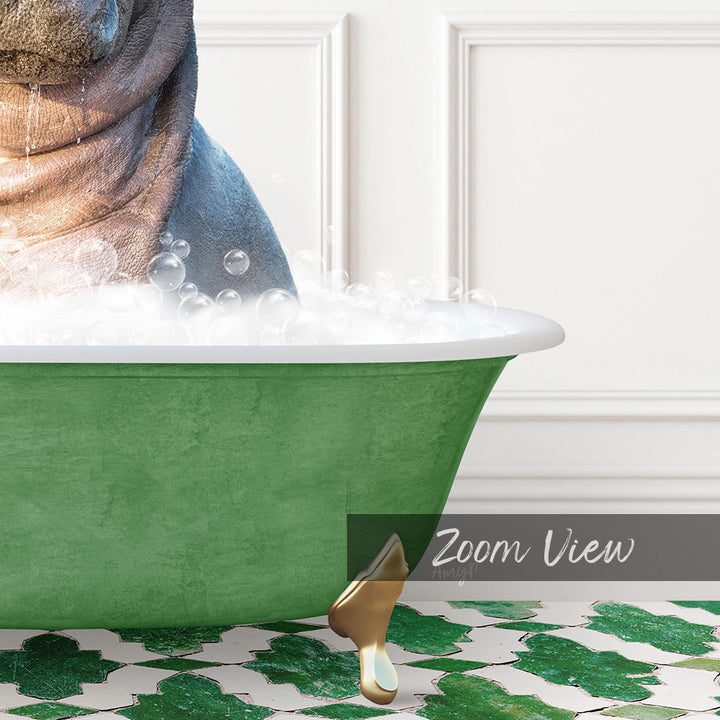 A green bathtub filled with bubbles, with a gold bathtub leg visible, and a white wall in the background.