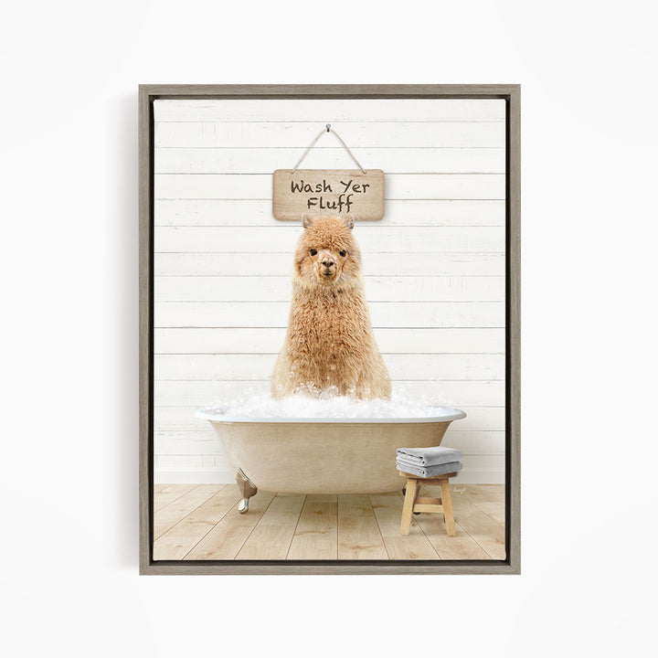 A fluffy brown dog sitting in a bathtub filled with bubbles, with a sign above that says "Wash Yer Fluff".