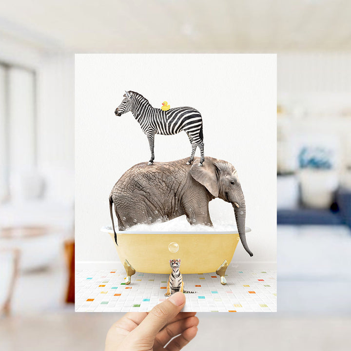A hand holds up a collage of images depicting a zebra standing on an elephant's back while both animals are in a bathtub filled with bubbles.