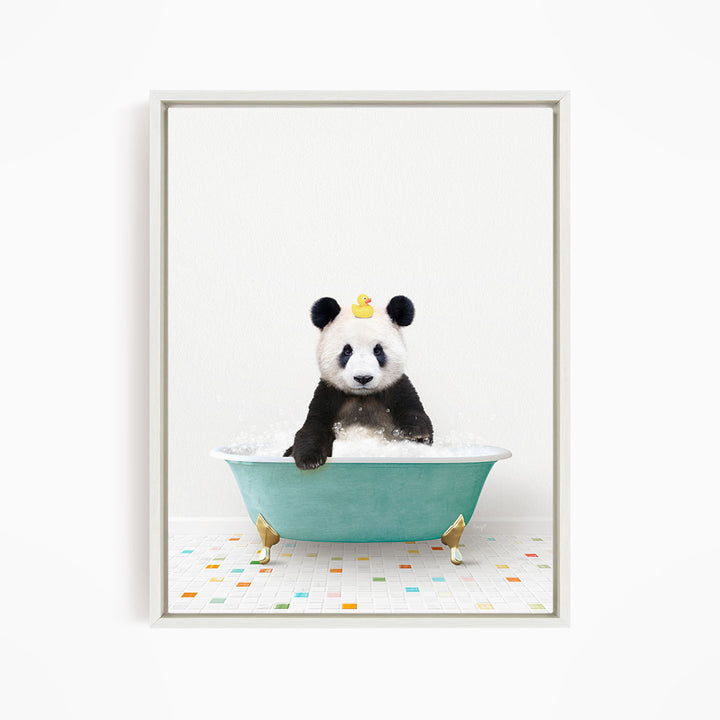 A panda bear sitting in a green bathtub, with a yellow rubber duck on its head.
