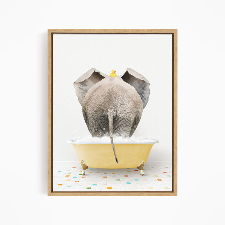 An elephant is standing in a yellow bathtub filled with water, with a rubber duck perched on its head.