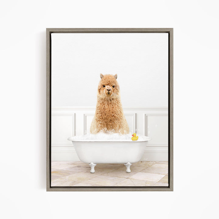 A fluffy brown alpaca sits in a white bathtub filled with water, with a rubber duck floating nearby.