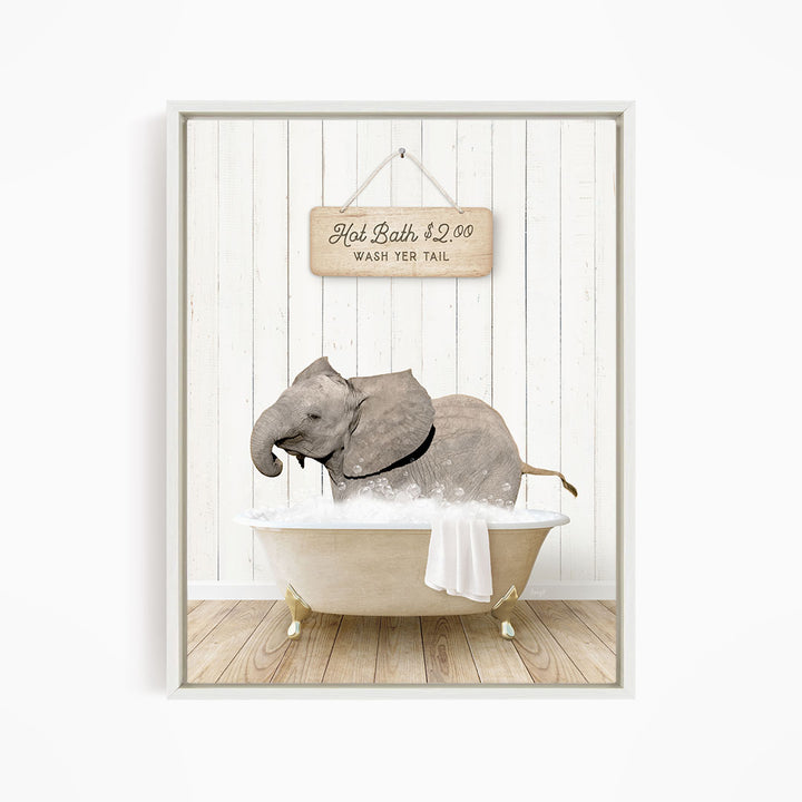 A gray elephant is sitting in a white bathtub, with a sign above it that reads "Hot Bath $2.00 Wash Your Tail".