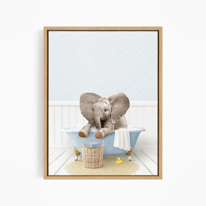 A baby elephant sitting in a blue bathtub, surrounded by a basket of toys and a yellow rubber ducky.