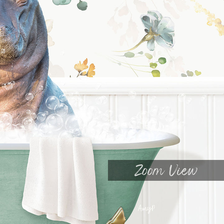 A close-up of a bathtub filled with bubbles, with a towel draped over the side and a floral pattern on the wall behind it.