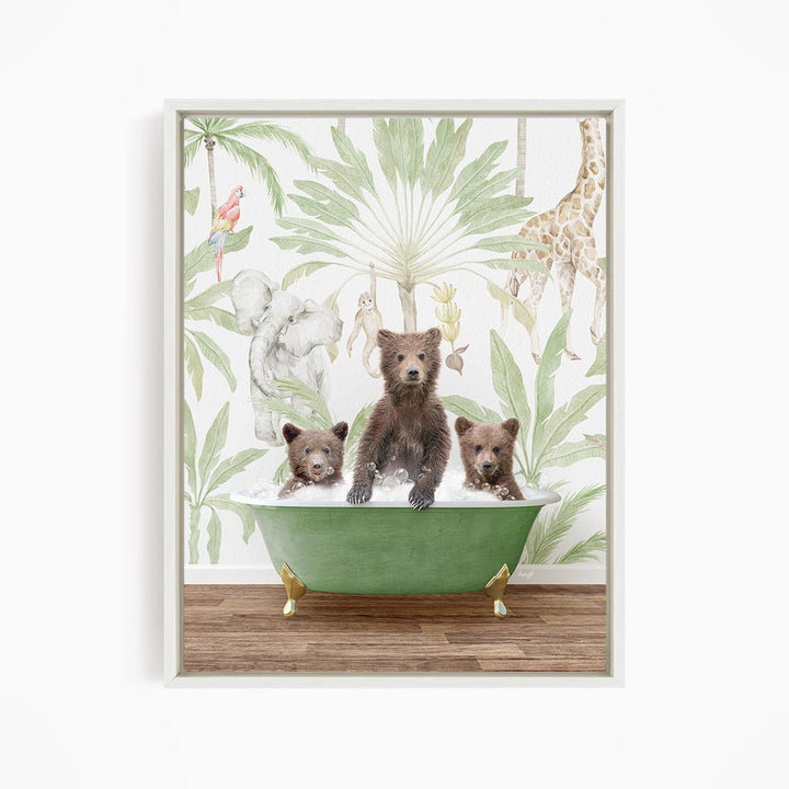 A framed print depicting three bears sitting in a green bathtub, surrounded by a tropical jungle wallpaper with various animals and plants.