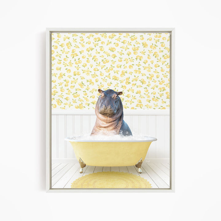 A hippopotamus sitting in a yellow bathtub filled with water, surrounded by a yellow and white floral patterned wall.